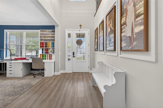 7570 Sweeter Tide Trl, Wesley Chapel, FL 33545 - entrance foyer with wood finished floors, ornamental molding, and built in study area