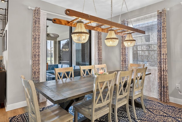 7570 Sweeter Tide Trl, Wesley Chapel, FL 33545 - dining room featuring a chandelier and wood finished floors