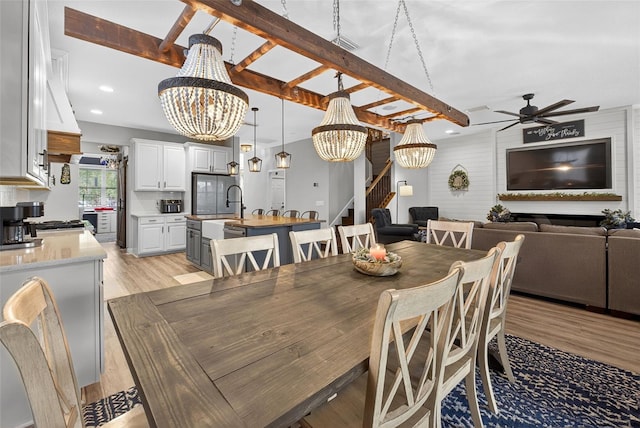 7570 Sweeter Tide Trl, Wesley Chapel, FL 33545 - dining space with a chandelier, stairway, light wood finished floors, a ceiling fan, and recessed lighting