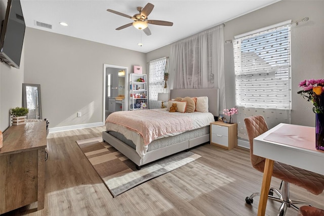 7570 Sweeter Tide Trl, Wesley Chapel, FL 33545 - bedroom with wood finished floors, ensuite bathroom, ceiling fan, and recessed lighting
