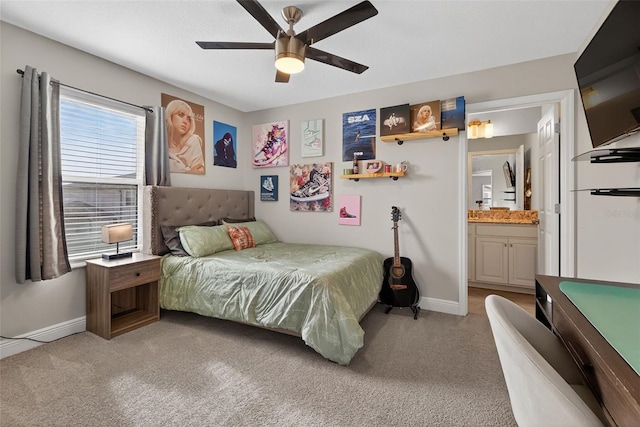 7570 Sweeter Tide Trl, Wesley Chapel, FL 33545 - bedroom featuring light carpet, ensuite bath, and ceiling fan