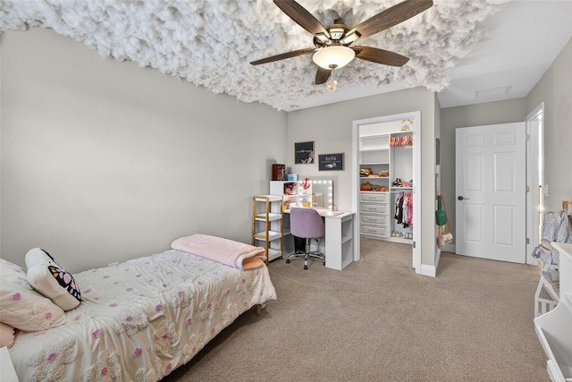 7570 Sweeter Tide Trl, Wesley Chapel, FL 33545 - bedroom with a walk in closet, light colored carpet, a closet, and ceiling fan