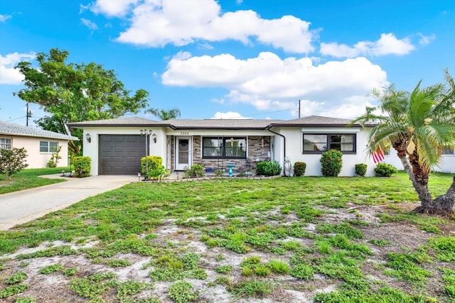 7305 Jasmine Blvd, Port Richey, FL 34668 - single story home with an attached garage, concrete driveway, stucco siding, and a front yard