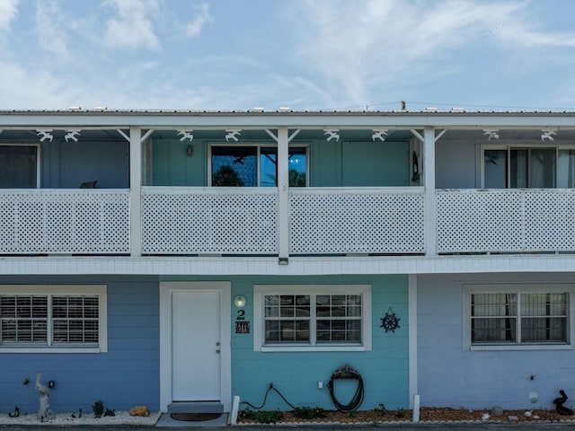 511 1st St, Cedar Key, FL 32625 - view of front facade featuring concrete block siding