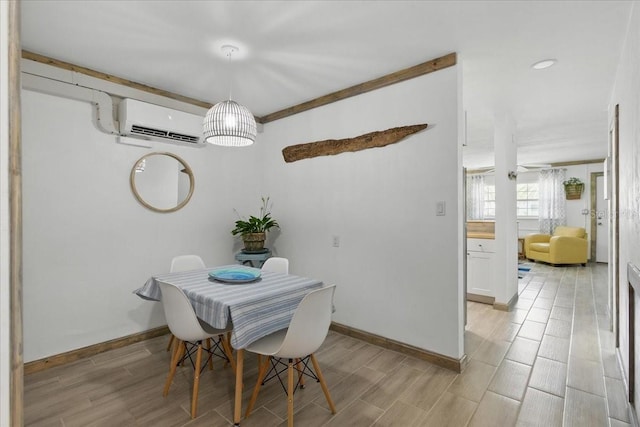 511 1st St, Cedar Key, FL 32625 - dining space with a wall mounted AC and wood tiled floors