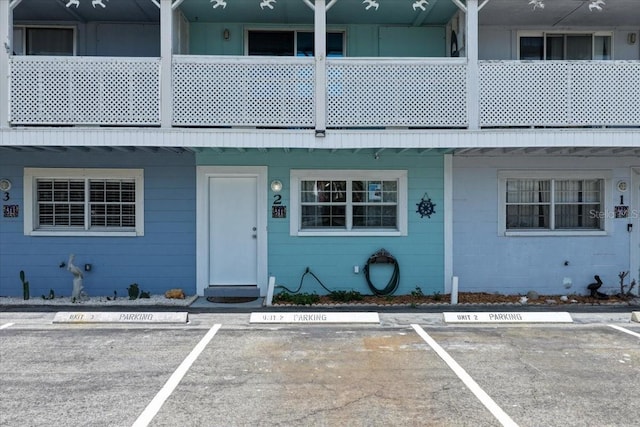511 1st St, Cedar Key, FL 32625 - view of front of property featuring uncovered parking and concrete block siding