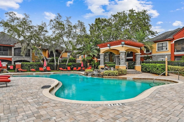 2171 Portofino Pl Unit 27-2725, Palm Harbor, FL 34683 - community pool featuring a patio area