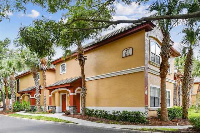2171 Portofino Pl Unit 27-2725, Palm Harbor, FL 34683 - view of front of house featuring stucco siding