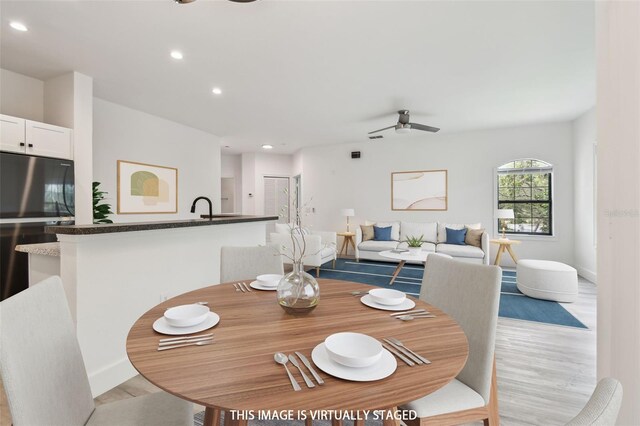 2171 Portofino Pl Unit 27-2725, Palm Harbor, FL 34683 - dining space with light wood finished floors, recessed lighting, a ceiling fan, and baseboards