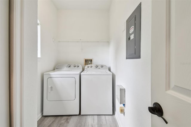 2171 Portofino Pl Unit 27-2725, Palm Harbor, FL 34683 - laundry area with separate washer and dryer, electric panel, light wood-style floors, and baseboards