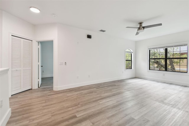 2171 Portofino Pl Unit 27-2725, Palm Harbor, FL 34683 - unfurnished room with ceiling fan, light wood-style flooring, and baseboards