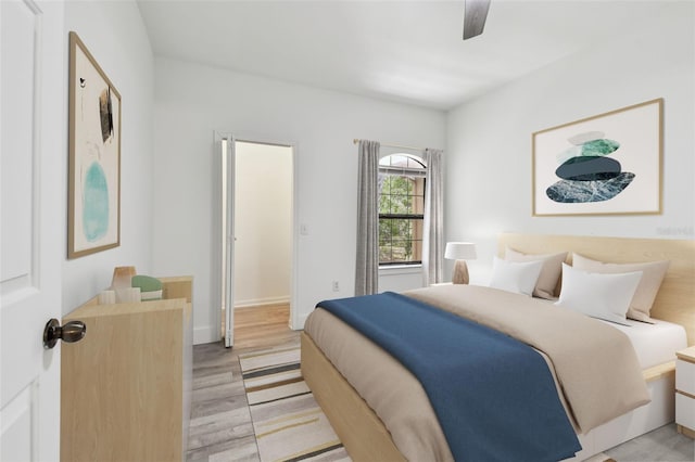 2171 Portofino Pl Unit 27-2725, Palm Harbor, FL 34683 - bedroom featuring light wood-style flooring, a ceiling fan, and baseboards