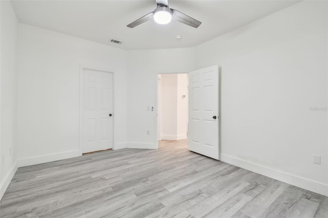 2171 Portofino Pl Unit 27-2725, Palm Harbor, FL 34683 - unfurnished bedroom featuring light wood-type flooring, baseboards, and a ceiling fan