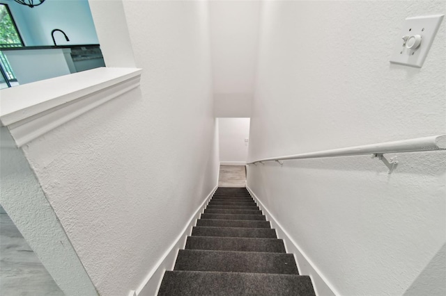 2171 Portofino Pl Unit 27-2725, Palm Harbor, FL 34683 - staircase with a textured wall