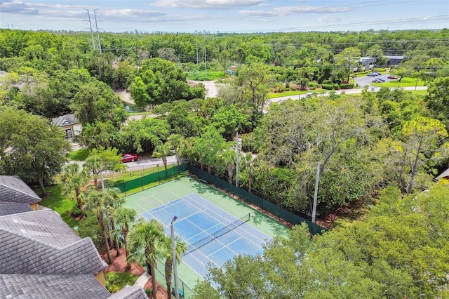 2171 Portofino Pl Unit 27-2725, Palm Harbor, FL 34683 - view of tennis court with a forest view