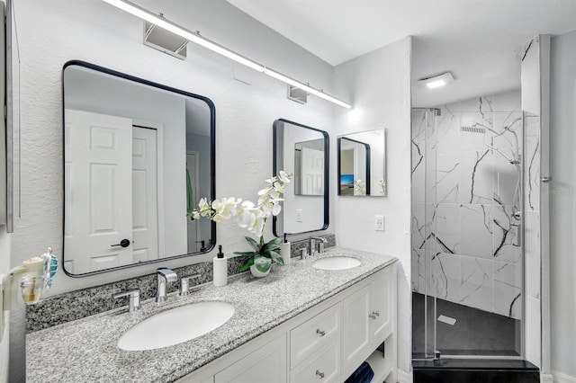 28 SW 21st Ave, Cape Coral, FL 33991 - full bathroom featuring a marble finish shower and double vanity