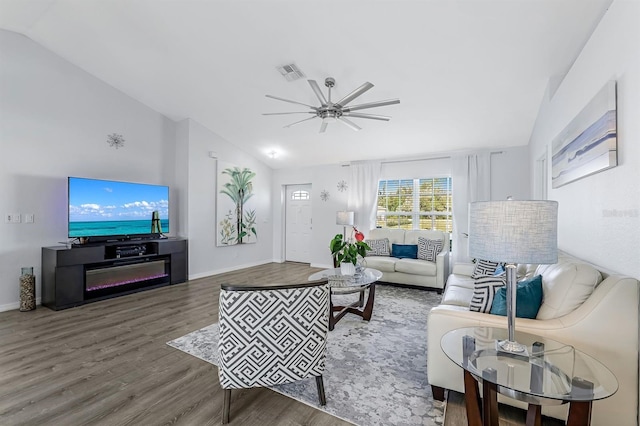 28 SW 21st Ave, Cape Coral, FL 33991 - living room featuring vaulted ceiling, wood finished floors, a ceiling fan, and baseboards