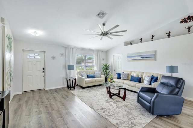28 SW 21st Ave, Cape Coral, FL 33991 - living room with a ceiling fan, wood finished floors, vaulted ceiling, and baseboards
