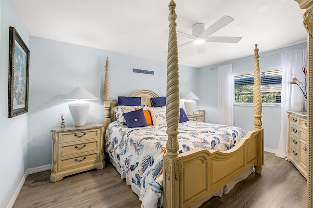 28 SW 21st Ave, Cape Coral, FL 33991 - bedroom with wood finished floors, baseboards, and ceiling fan