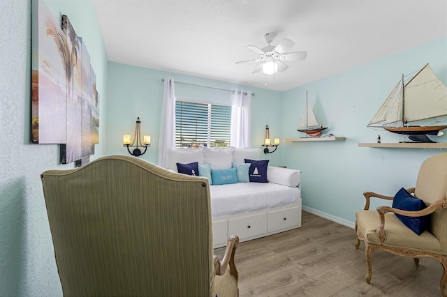 28 SW 21st Ave, Cape Coral, FL 33991 - bedroom featuring wood finished floors, a ceiling fan, and baseboards