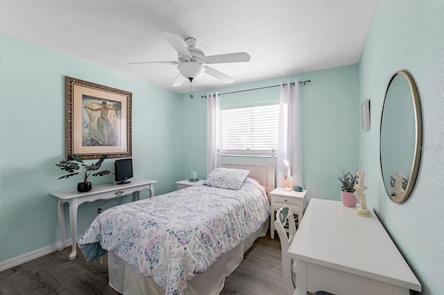 28 SW 21st Ave, Cape Coral, FL 33991 - bedroom featuring wood finished floors, a ceiling fan, and baseboards
