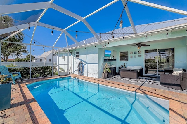 28 SW 21st Ave, Cape Coral, FL 33991 - swimming pool featuring a ceiling fan, a patio area, an outdoor living space, and a lanai