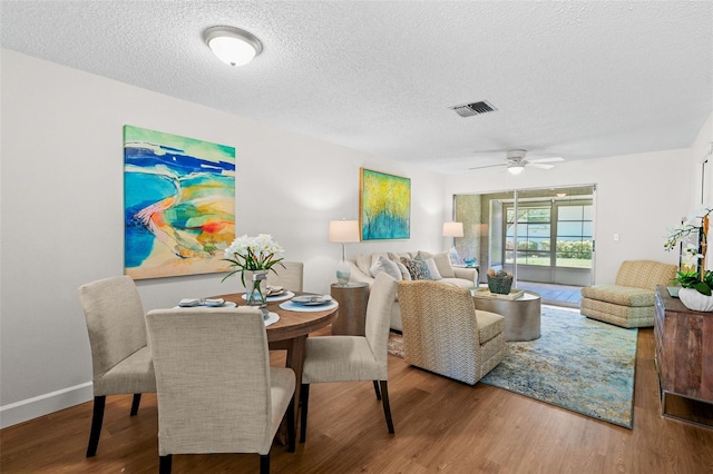 2460 Northside Dr Unit 802, Clearwater, FL 33761 - living area with wood finished floors, a textured ceiling, and ceiling fan