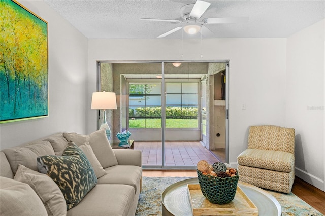 2460 Northside Dr Unit 802, Clearwater, FL 33761 - living room with wood finished floors, ceiling fan, and a textured ceiling