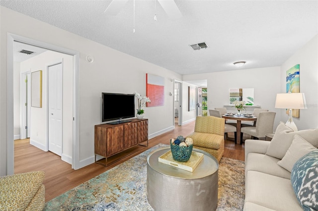 2460 Northside Dr Unit 802, Clearwater, FL 33761 - living room featuring wood finished floors and a ceiling fan