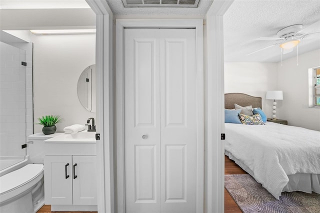2460 Northside Dr Unit 802, Clearwater, FL 33761 - full bath with vanity, a closet, shower / bathtub combination, wood finished floors, and a ceiling fan