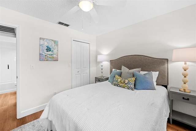 2460 Northside Dr Unit 802, Clearwater, FL 33761 - bedroom featuring wood finished floors, a closet, and a ceiling fan