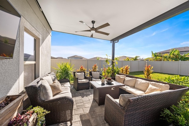 9334 Lemon Drop Loop, Sun City Center, FL 33573 - fenced backyard featuring an outdoor living space, a ceiling fan, and a patio area