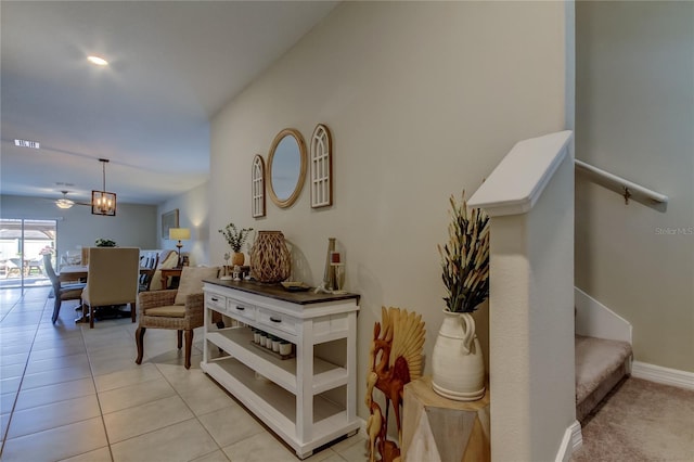 9334 Lemon Drop Loop, Sun City Center, FL 33573 - hall with baseboards, stairway, and light tile patterned flooring