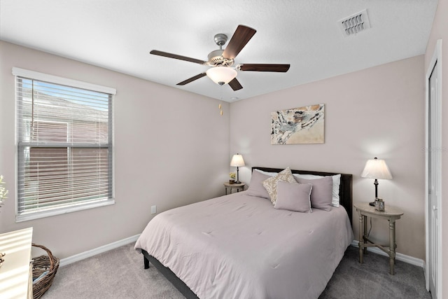 9334 Lemon Drop Loop, Sun City Center, FL 33573 - carpeted bedroom featuring baseboards and a ceiling fan