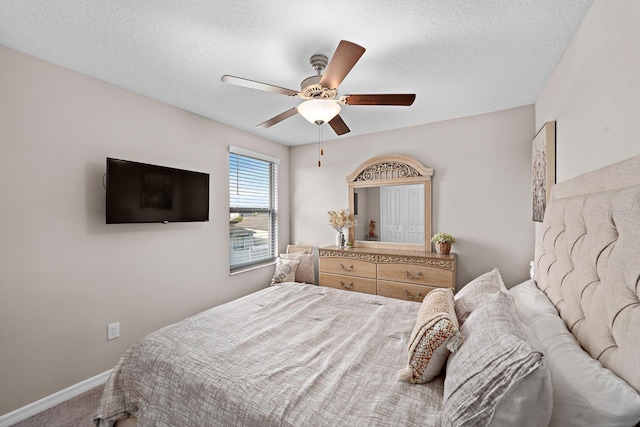 9334 Lemon Drop Loop, Sun City Center, FL 33573 - carpeted bedroom featuring a ceiling fan, a textured ceiling, and baseboards