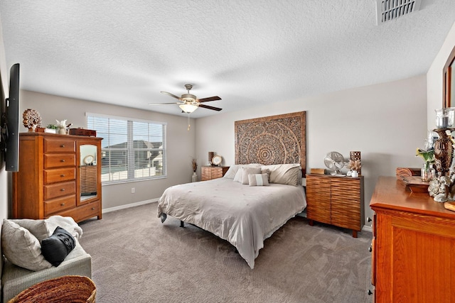 9334 Lemon Drop Loop, Sun City Center, FL 33573 - carpeted bedroom with baseboards, a ceiling fan, and a textured ceiling