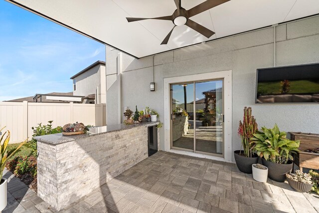 9334 Lemon Drop Loop, Sun City Center, FL 33573 - view of patio featuring a ceiling fan