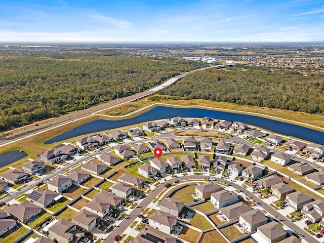 9334 Lemon Drop Loop, Sun City Center, FL 33573 - view of property location with a heavily wooded area, a large body of water, and nearby suburban area