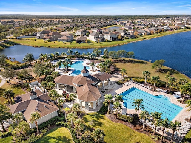 9334 Lemon Drop Loop, Sun City Center, FL 33573 - aerial view of residential area featuring a pool and a large body of water