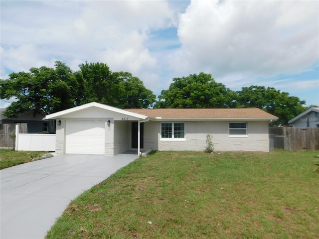 4417 Kohler St, New Port Richey, FL 34652 - single story home with an attached garage, driveway, and stucco siding