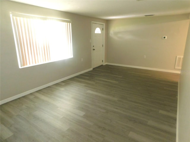 4417 Kohler St, New Port Richey, FL 34652 - foyer with baseboards and wood finished floors