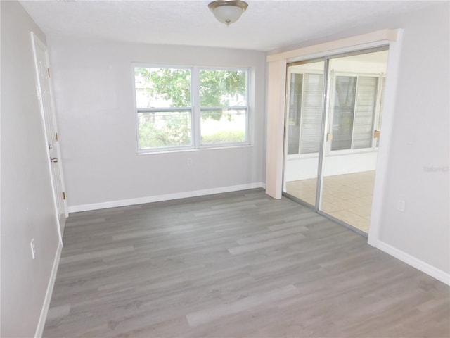 4417 Kohler St, New Port Richey, FL 34652 - unfurnished room with baseboards and wood finished floors