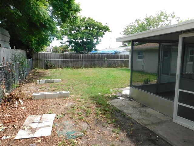 4417 Kohler St, New Port Richey, FL 34652 - view of yard featuring a sunroom and a garden