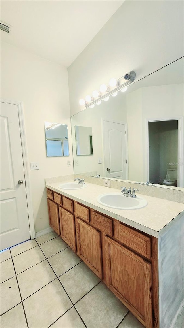 221 Fairmont Dr, Spring Hill, FL 34609 - full bathroom featuring double vanity and tile patterned flooring