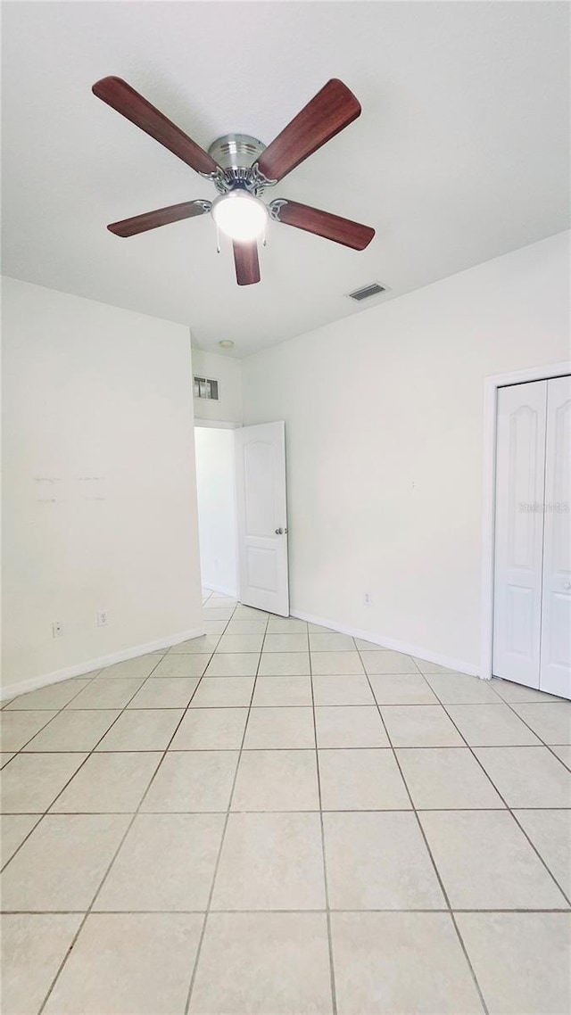 221 Fairmont Dr, Spring Hill, FL 34609 - unfurnished room with light tile patterned floors and a ceiling fan