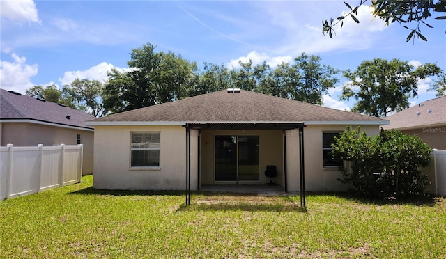 221 Fairmont Dr, Spring Hill, FL 34609 - back of house with stucco siding, roof with shingles, and a patio