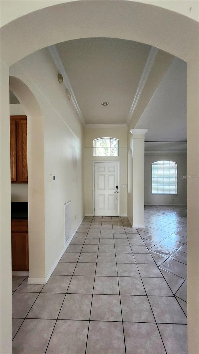 221 Fairmont Dr, Spring Hill, FL 34609 - entrance foyer featuring ornamental molding and light tile patterned floors