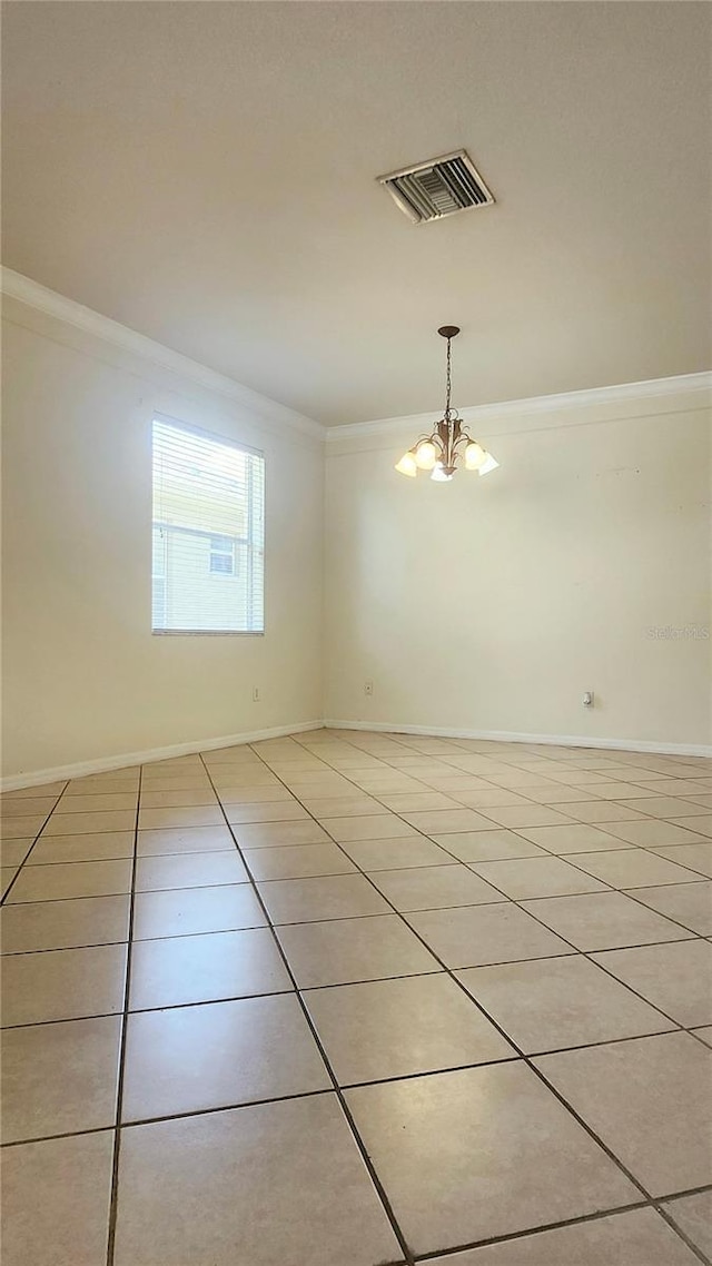 221 Fairmont Dr, Spring Hill, FL 34609 - spare room with crown molding, light tile patterned flooring, and a chandelier