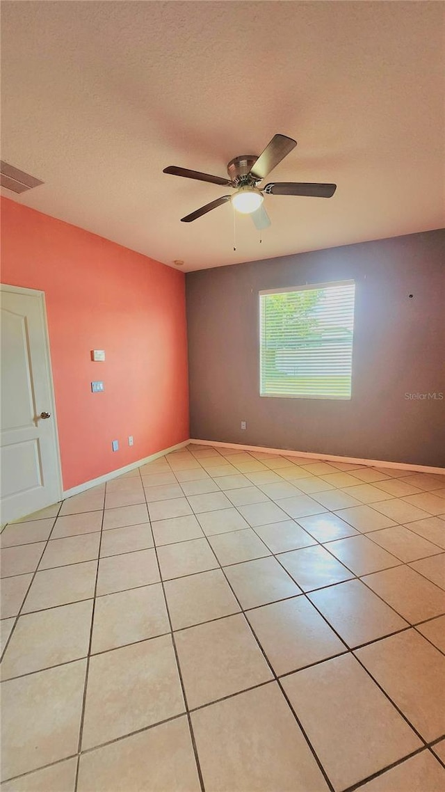 221 Fairmont Dr, Spring Hill, FL 34609 - empty room with light tile patterned flooring and ceiling fan