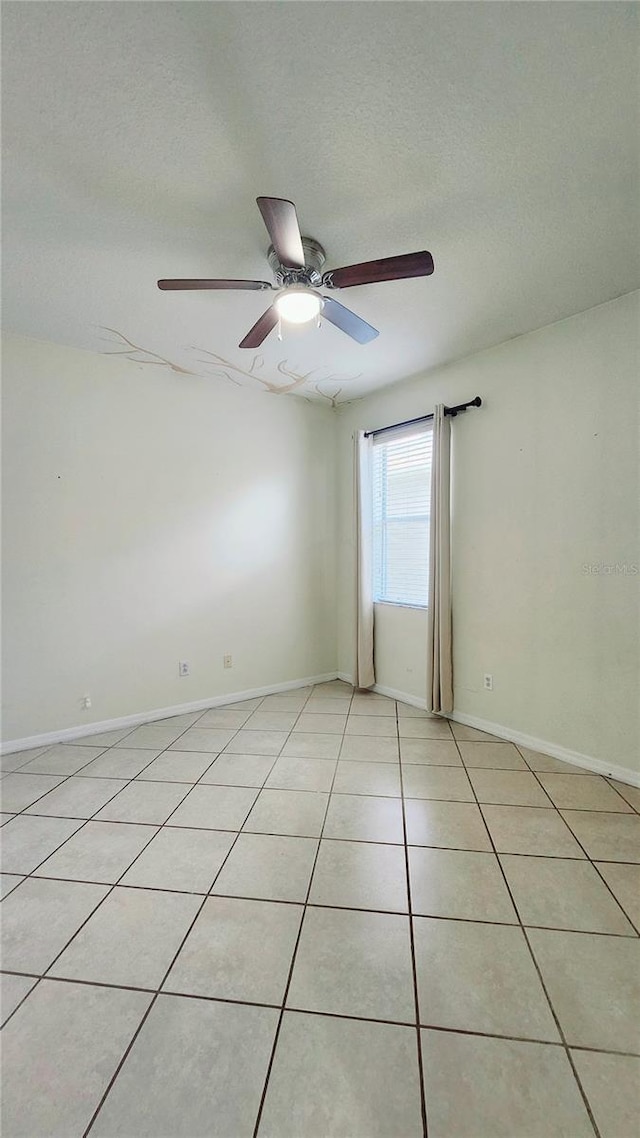 221 Fairmont Dr, Spring Hill, FL 34609 - spare room with a ceiling fan and light tile patterned flooring